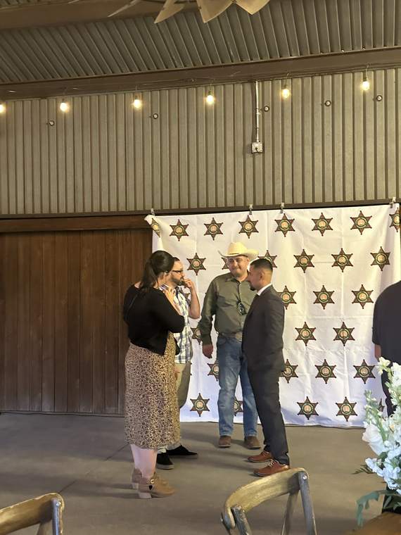 A badge pinning at an association ceremony