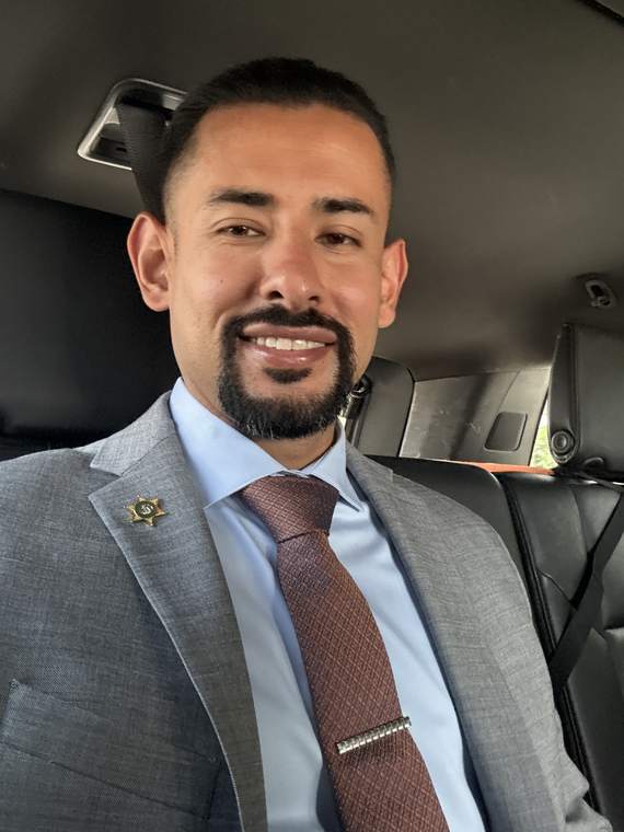 Jose Santos wearing the sheriff's star lapel pin
